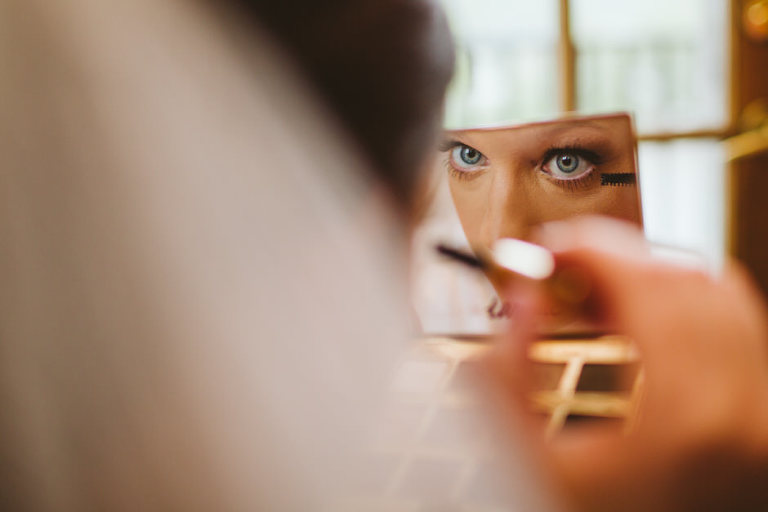 bride putting on mascara