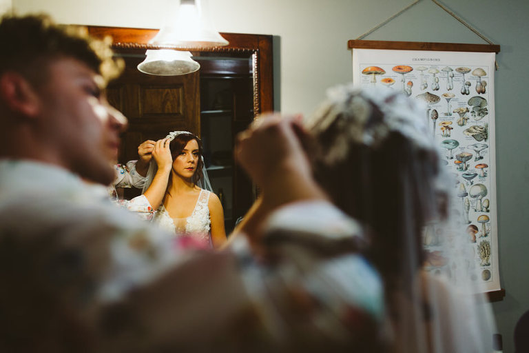 bride getting help with the veil