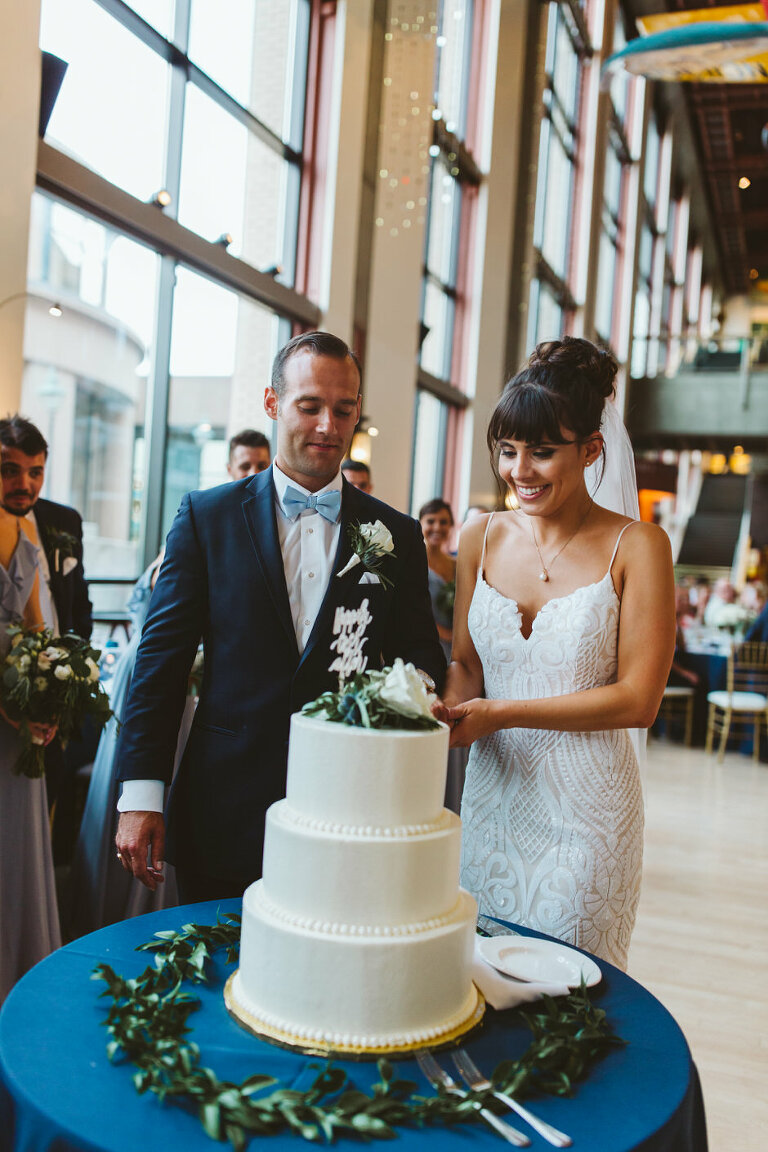 cutting the cake at a Grand Rapids Public Art Museum Wedding 