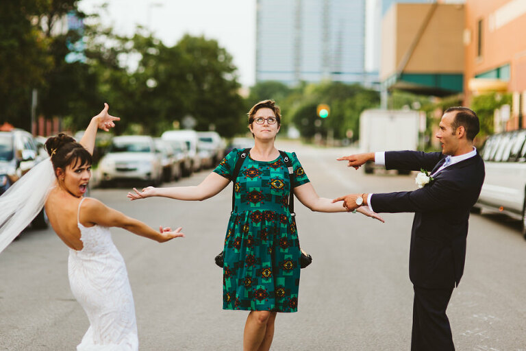 bride and groom pointing at their wedding photographer Rachel Kaye cause they love her 