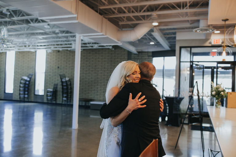 first look in reception space of Port 393. Couldn't be used for the party due to covid but the first look with the brides dad was perfect for this Port 393 Wedding photographer 