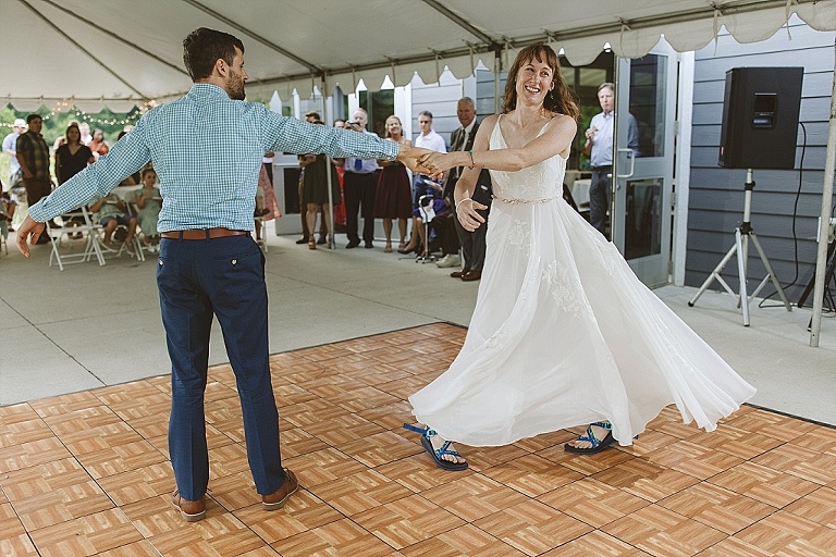 Couple dancing to bluegrass at forest wedding reception