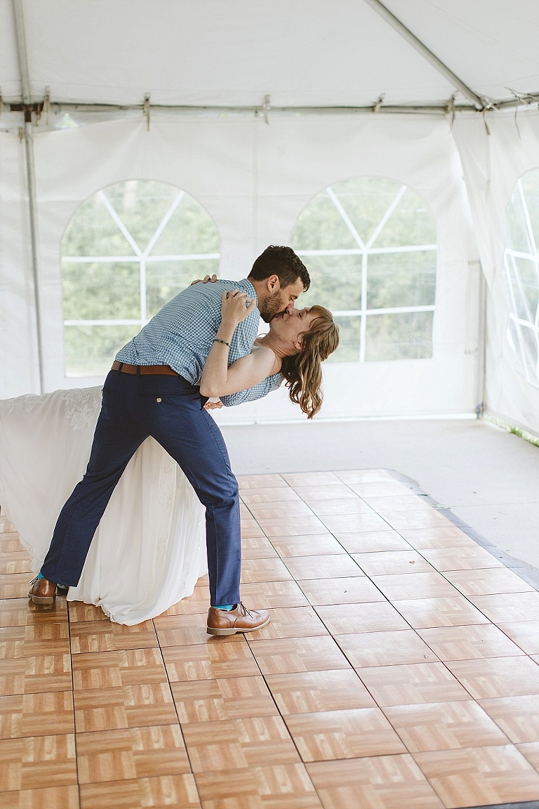 Couple dancing to bluegrass at forest wedding reception