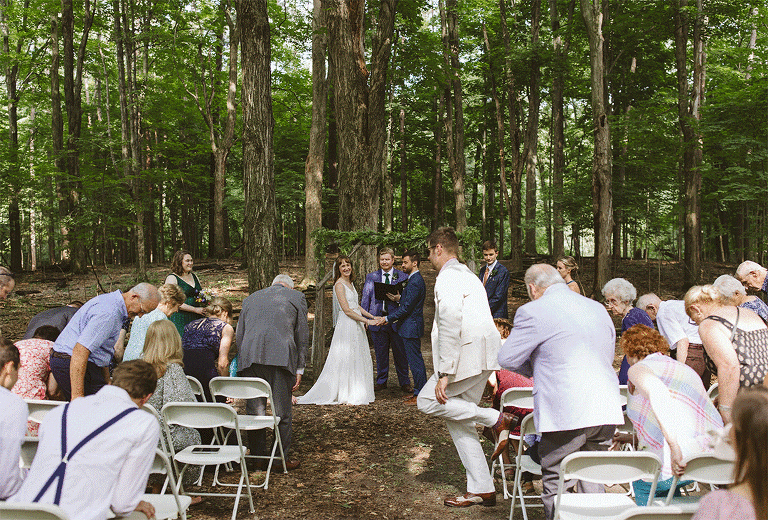 Outdoor ceremony under trees at Fenner Nature Center in Lansing, Michigan